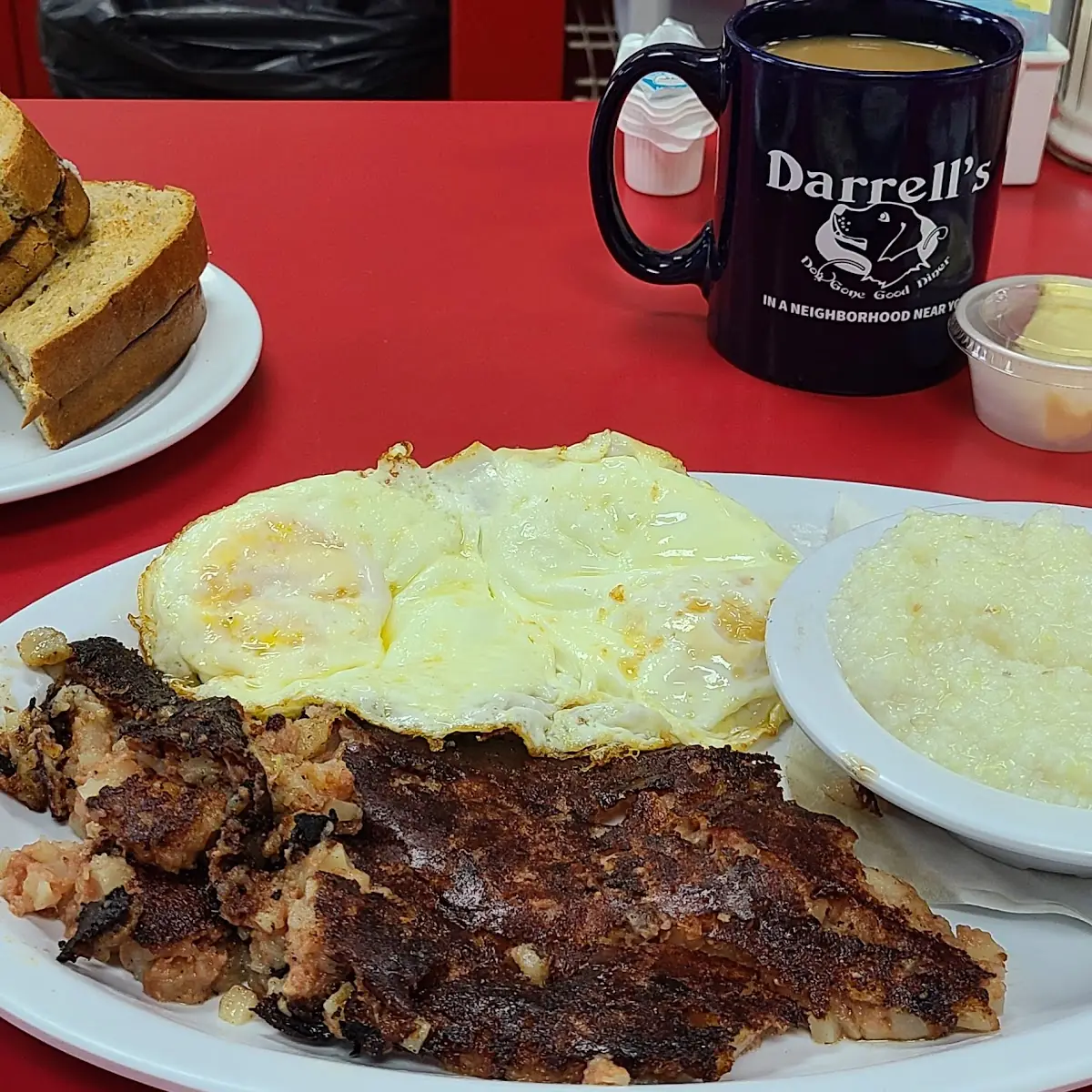 Corned Beef Hash Eggs over Medium Rye Toast and Grits