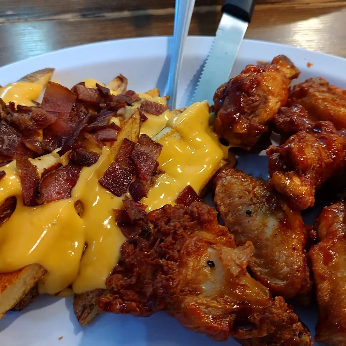 Chicken Wings and Cheese Fries with Bacon