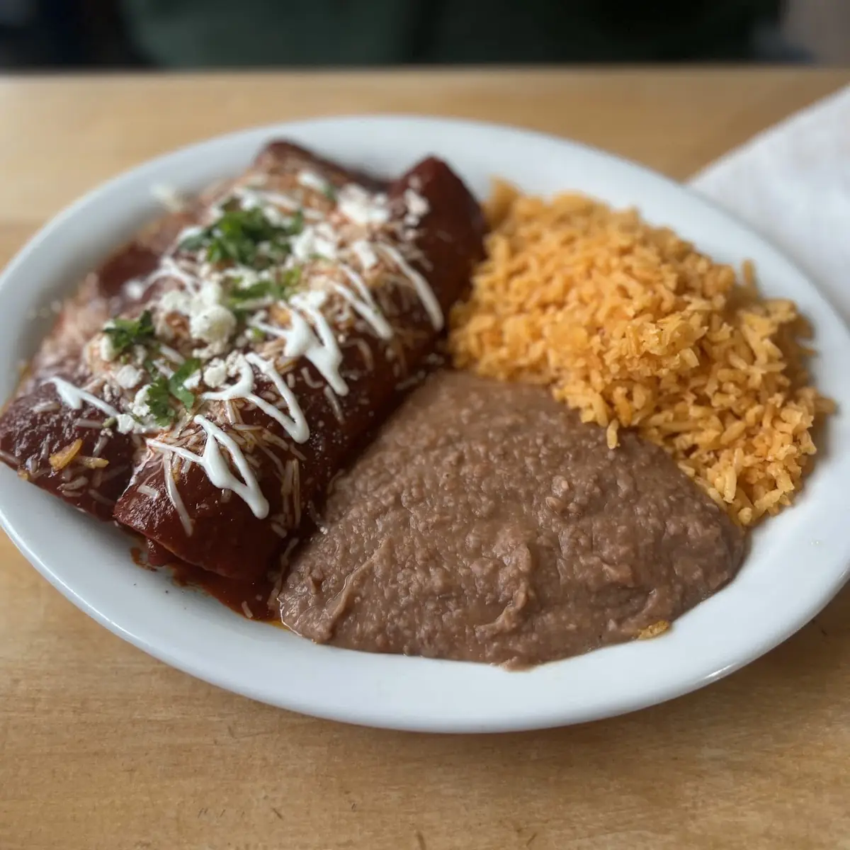 Enchilada and Refried Beans