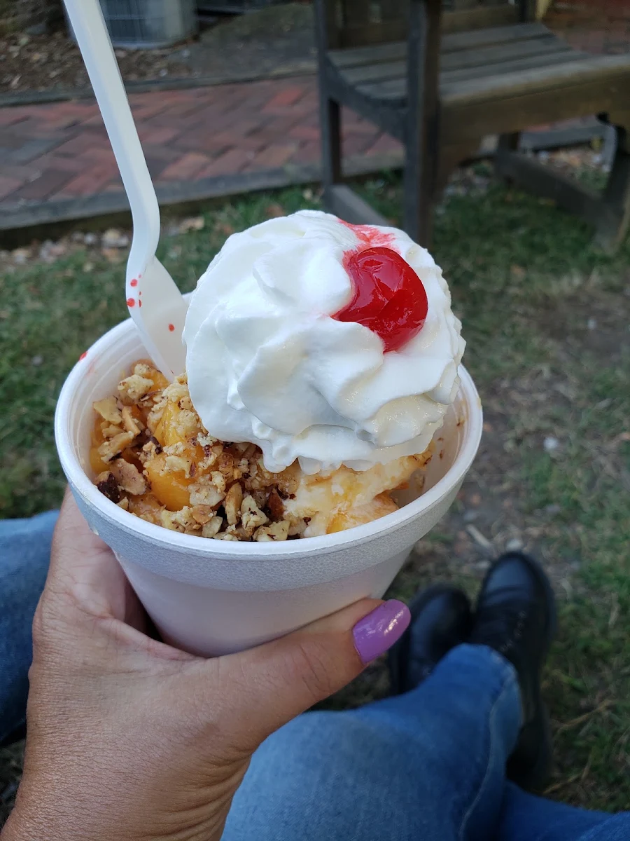 Fresh Peach Topping on Peach Ice Cream with Nuts