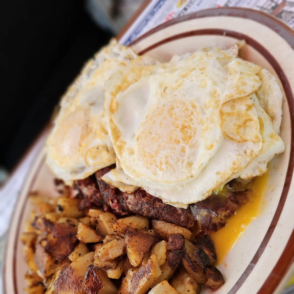 Eggs with Home Fries on a Roll