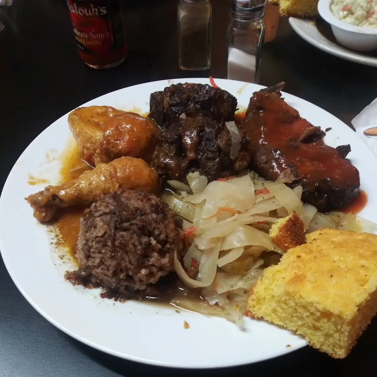 Curry Chicken Oxtail Jerk Chicken Cabbage and Cornbread