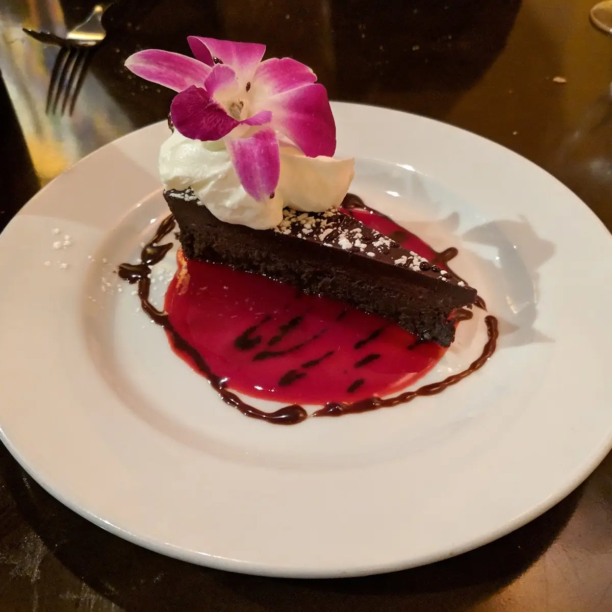 Bittersweet Flourless Chocolate Cake with Raspberry Sauce and Chantilly Cream