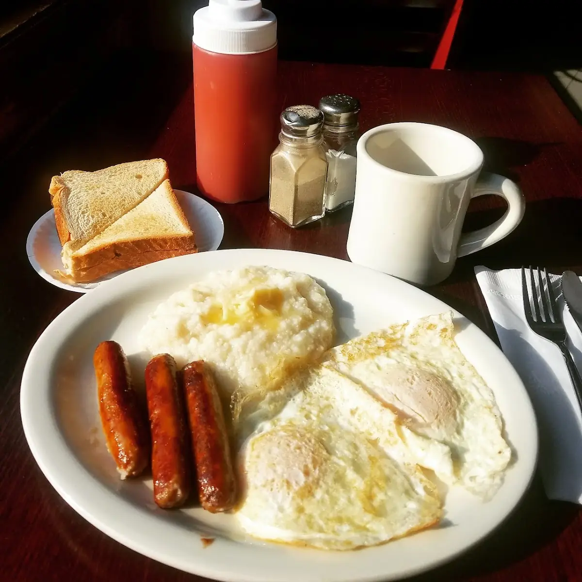 Two Eggs with Sausage and Grits