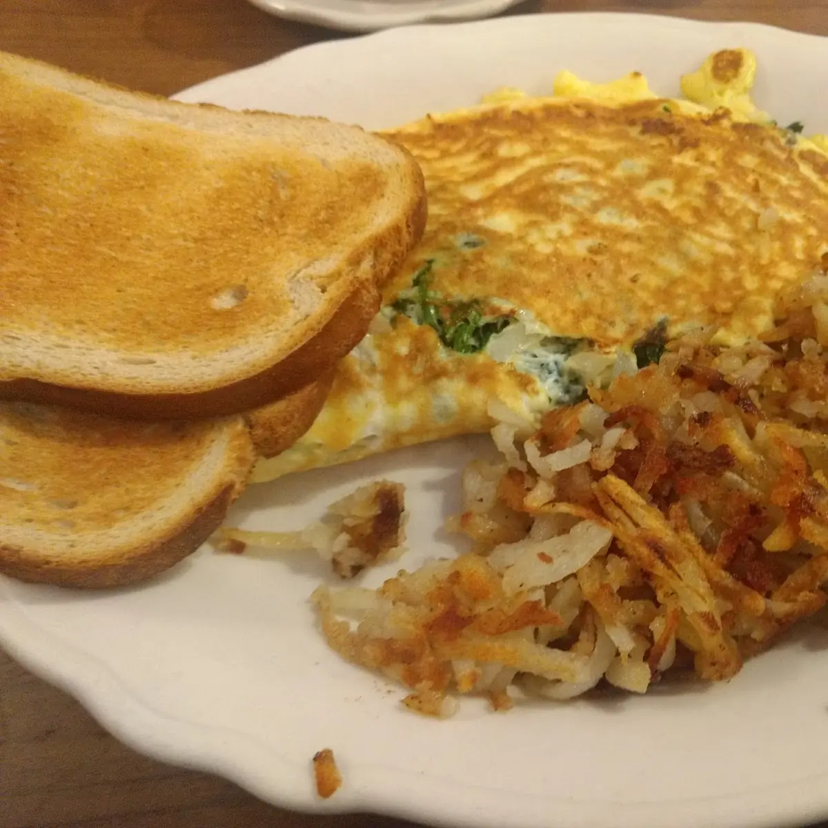 Omlette and Hash Browns and Rye Bread Toast