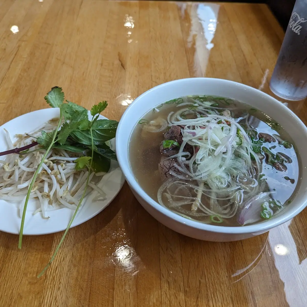 Steaming Beef Pho with Fresh Herbs