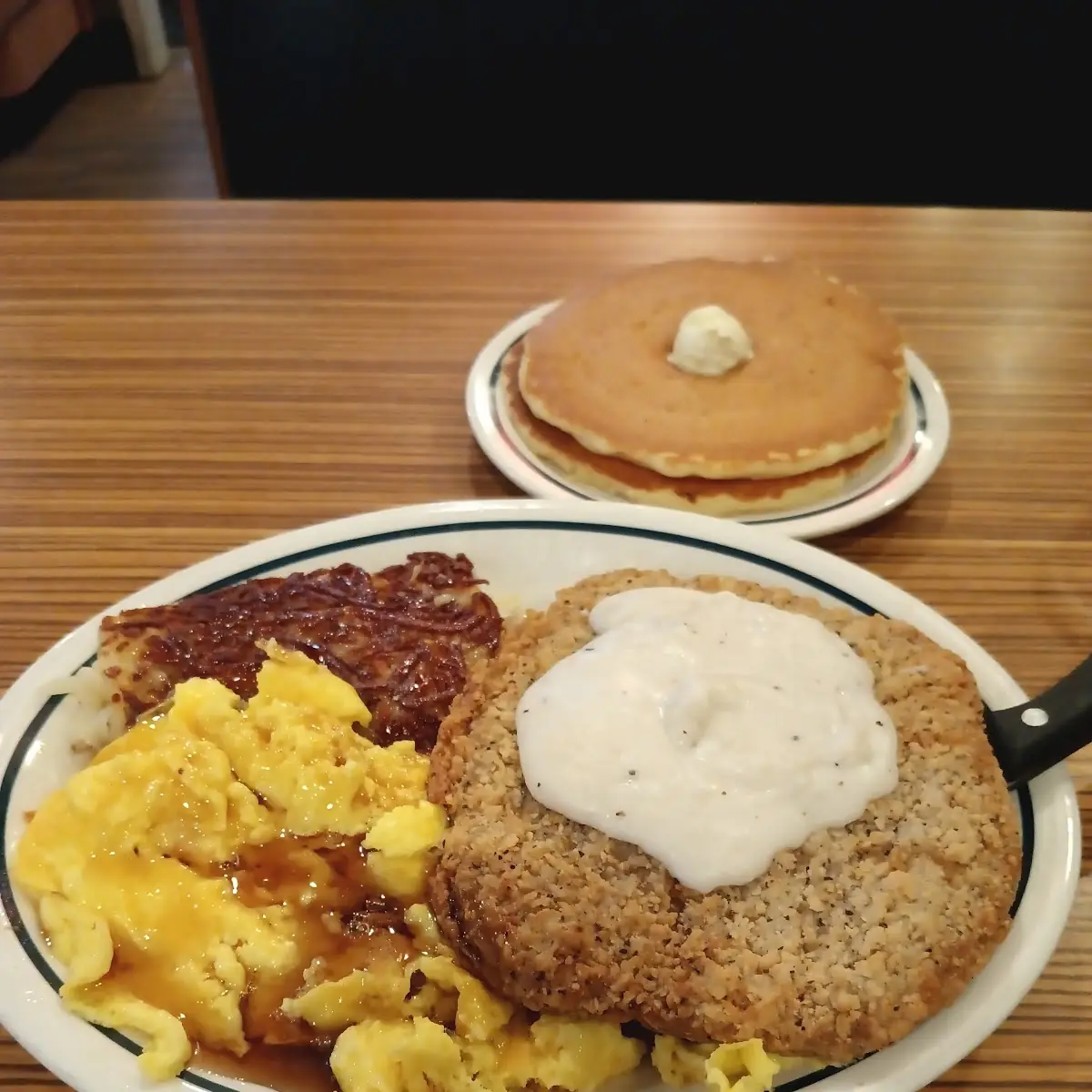 Country Fried Steak Hash Browns Eggs with Cheese and Pancakes