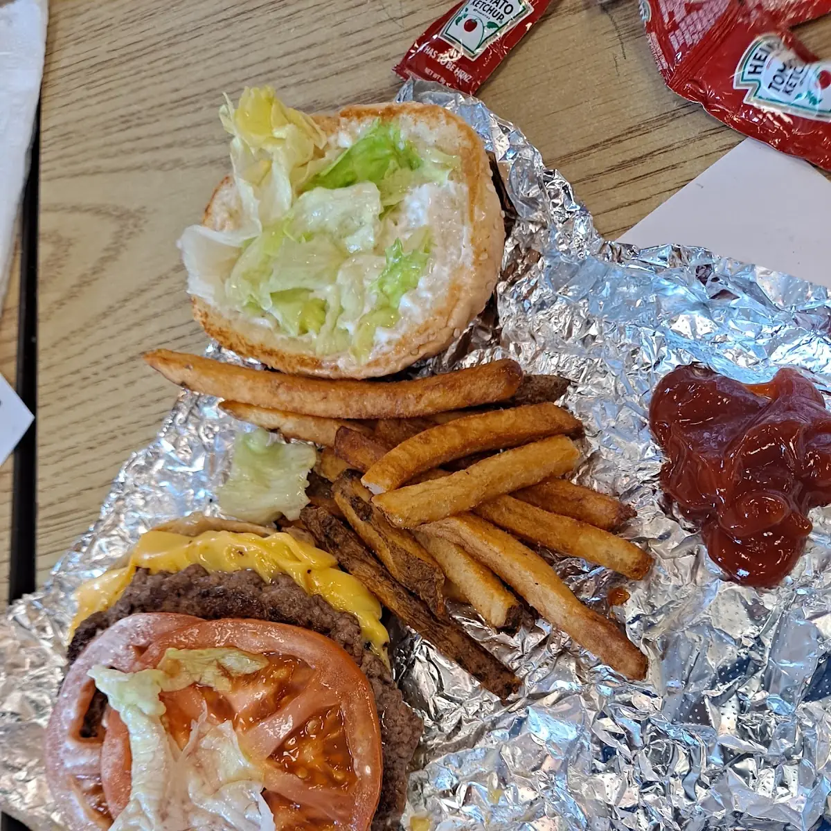 Double Cheese Burger with Lettuce Tomatoes and Grilled Onions