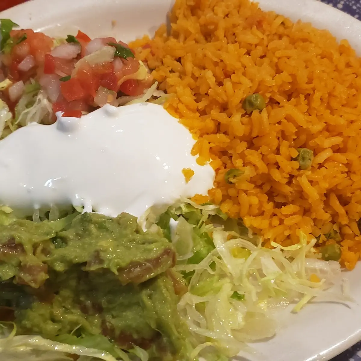 Guacamole Lettuce Salsa and Sour Cream