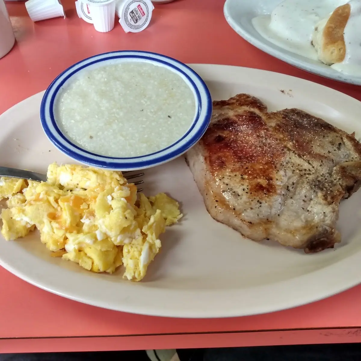Scrambled Eggs and Cheese with Pork Chop