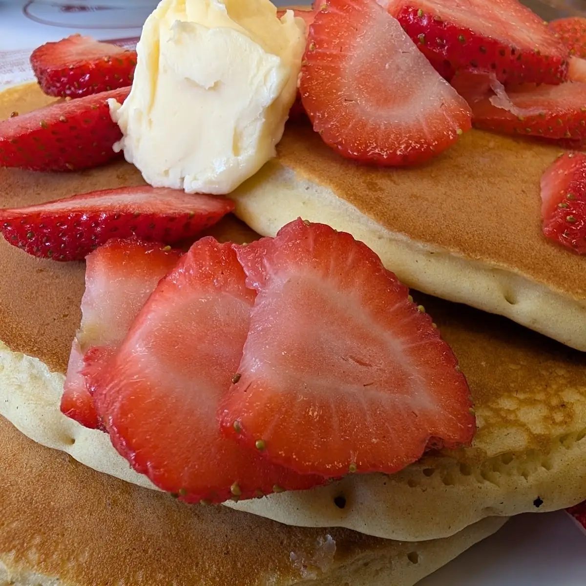 Buttermilk Pancakes with Strawberries on Top