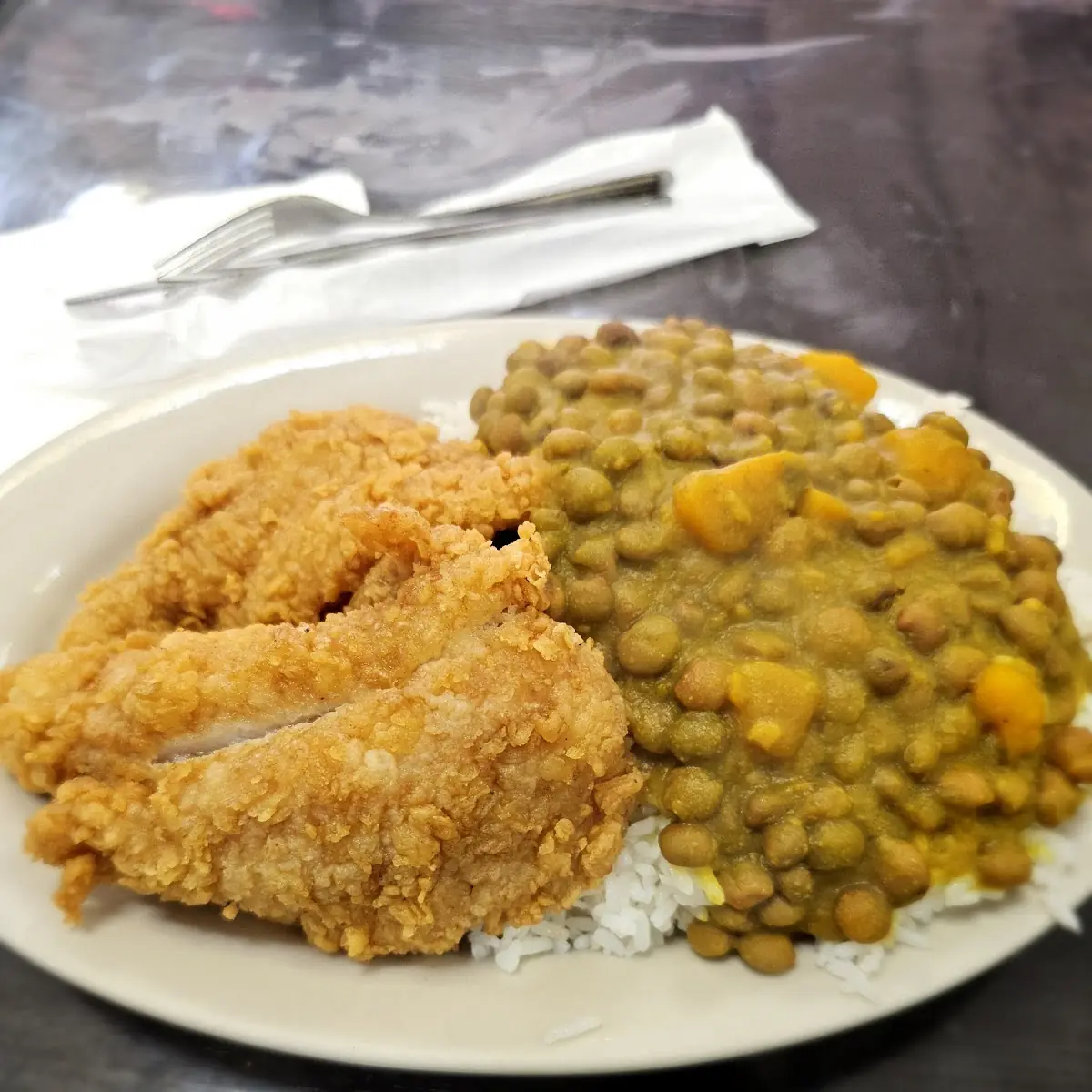 Fried Fish over Rice and Green Peas