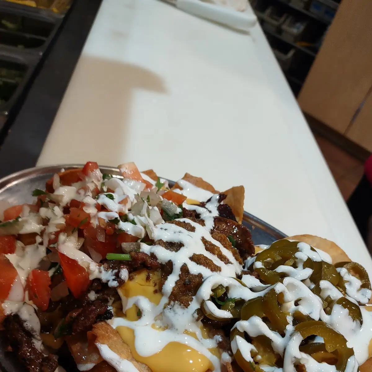 Beef Nachos with Sunny Side Up Eggs