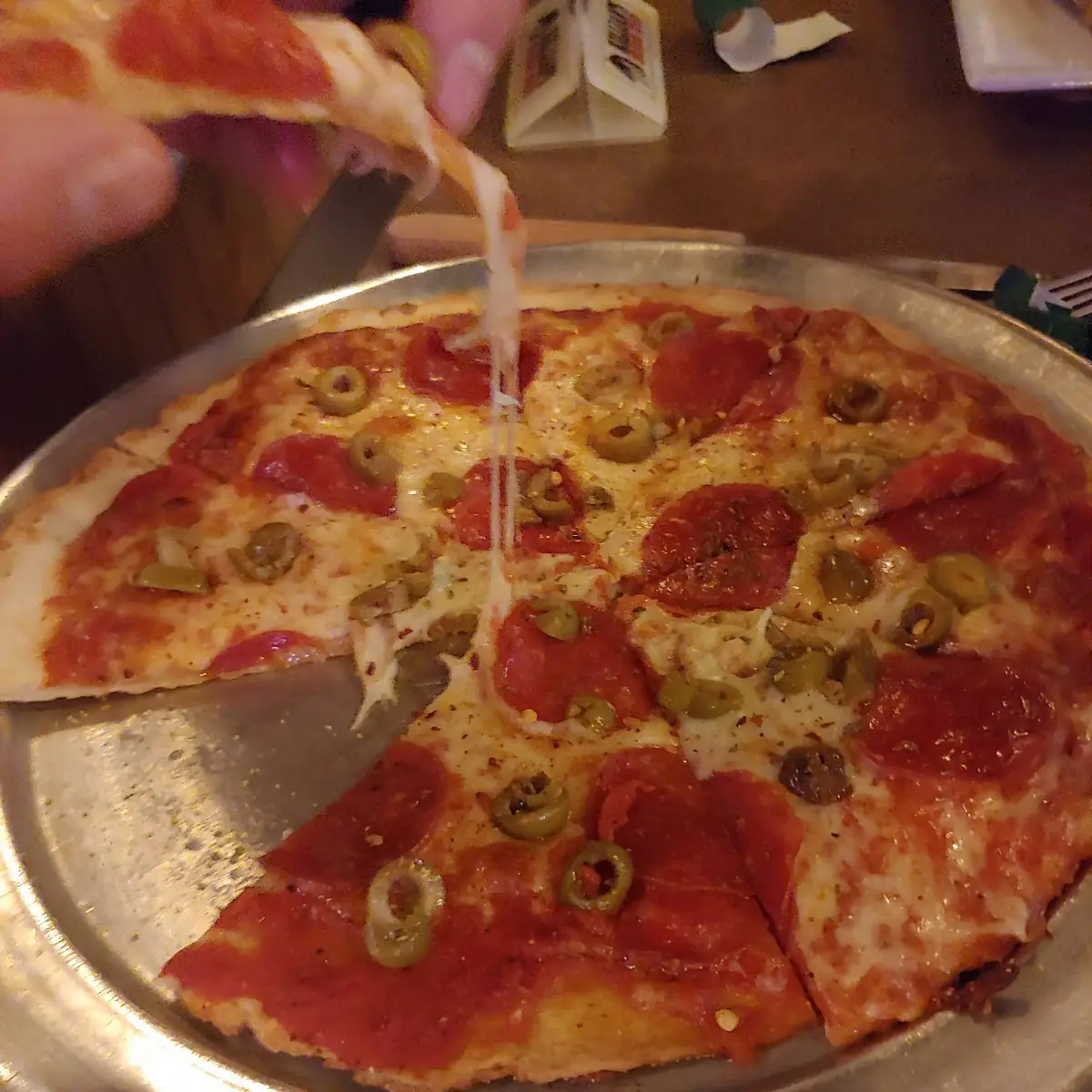Thin Crust Pepperoni Olives & Asiago Cheese Pizza