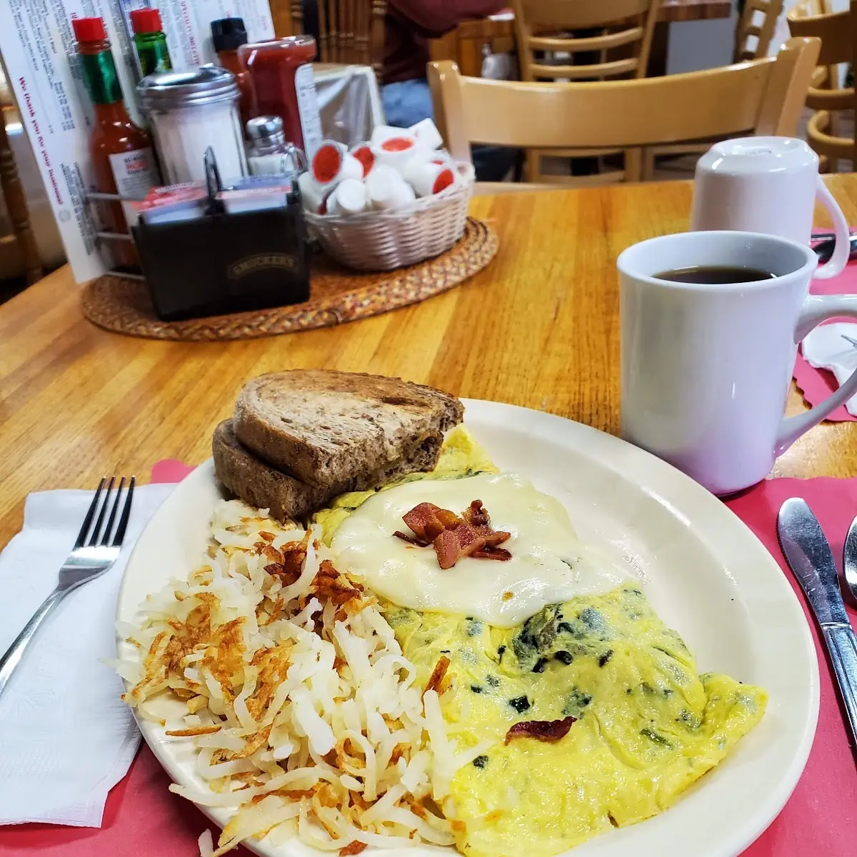 Spinach Omelette with Bacon Provolone Cheese Rye Toast Hash Browns Coffee