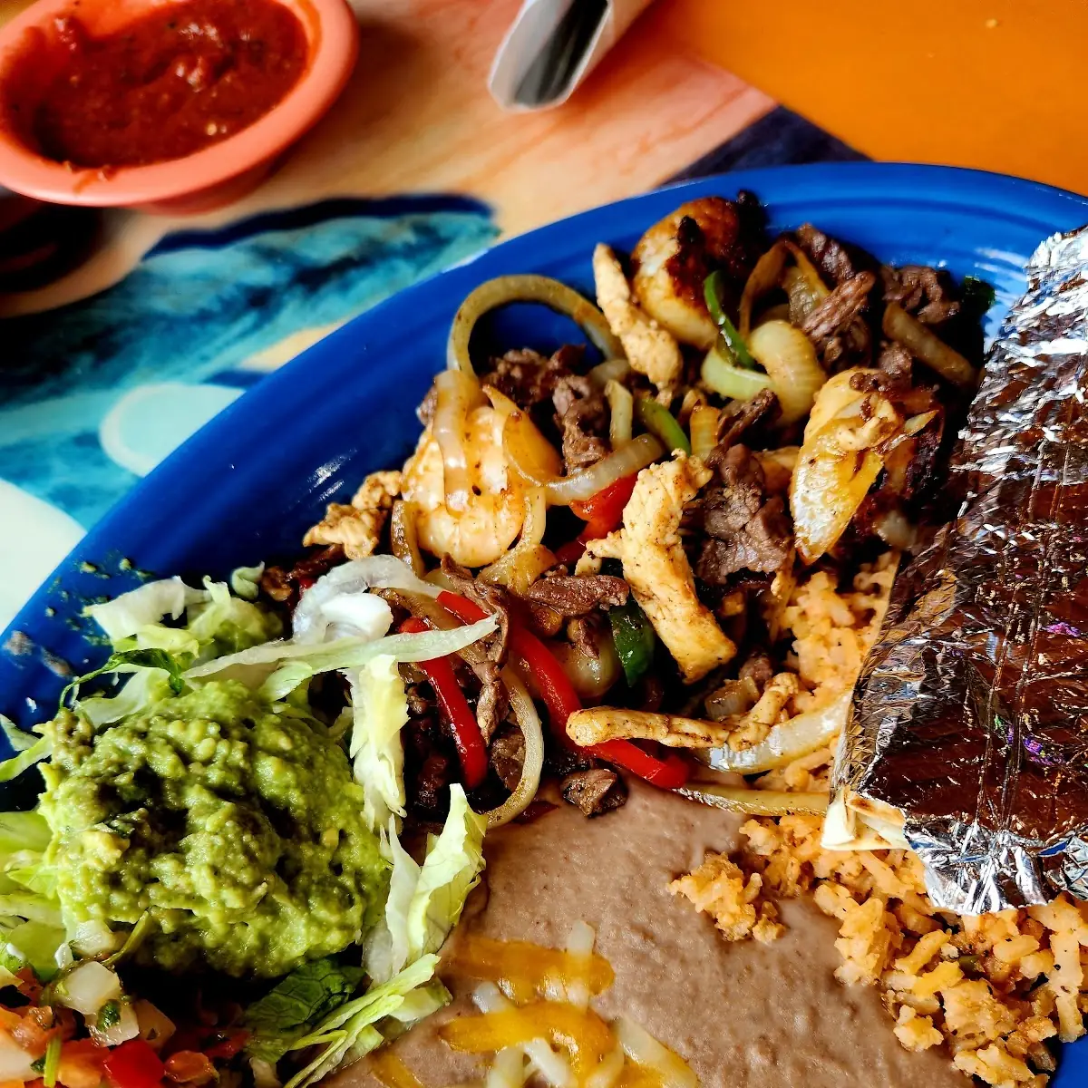 Steak Chicken and Shrimp Fajitas