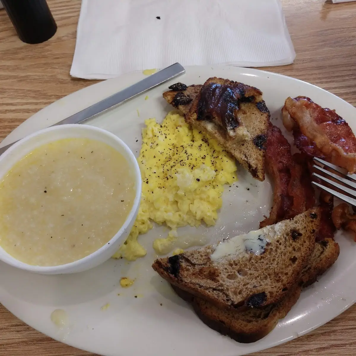 Scrambled Eggs Grits Raisin Toast and Bacon