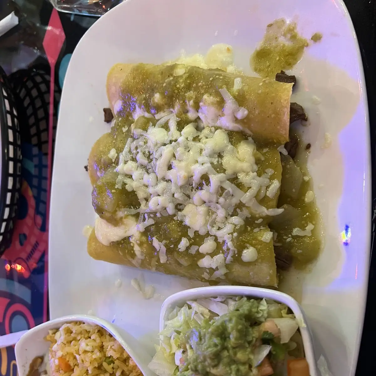 Mucho Grande Nachos; Steak, chicken and shrimp topped with, cheese, lettuce, guacamole, sour cream & pico de gallo.