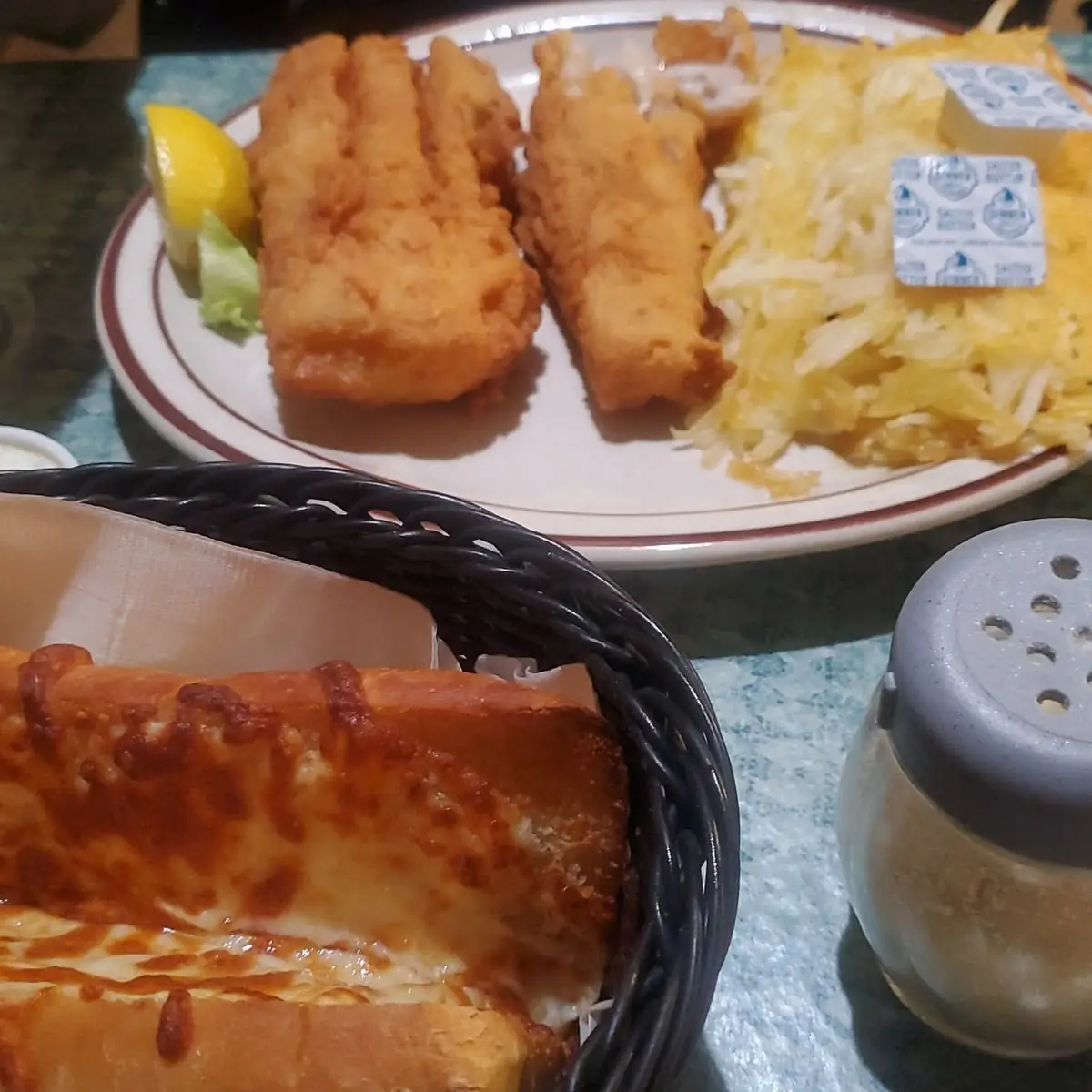 That Is Garlic Toast on Bottom and Cod Hash Browns