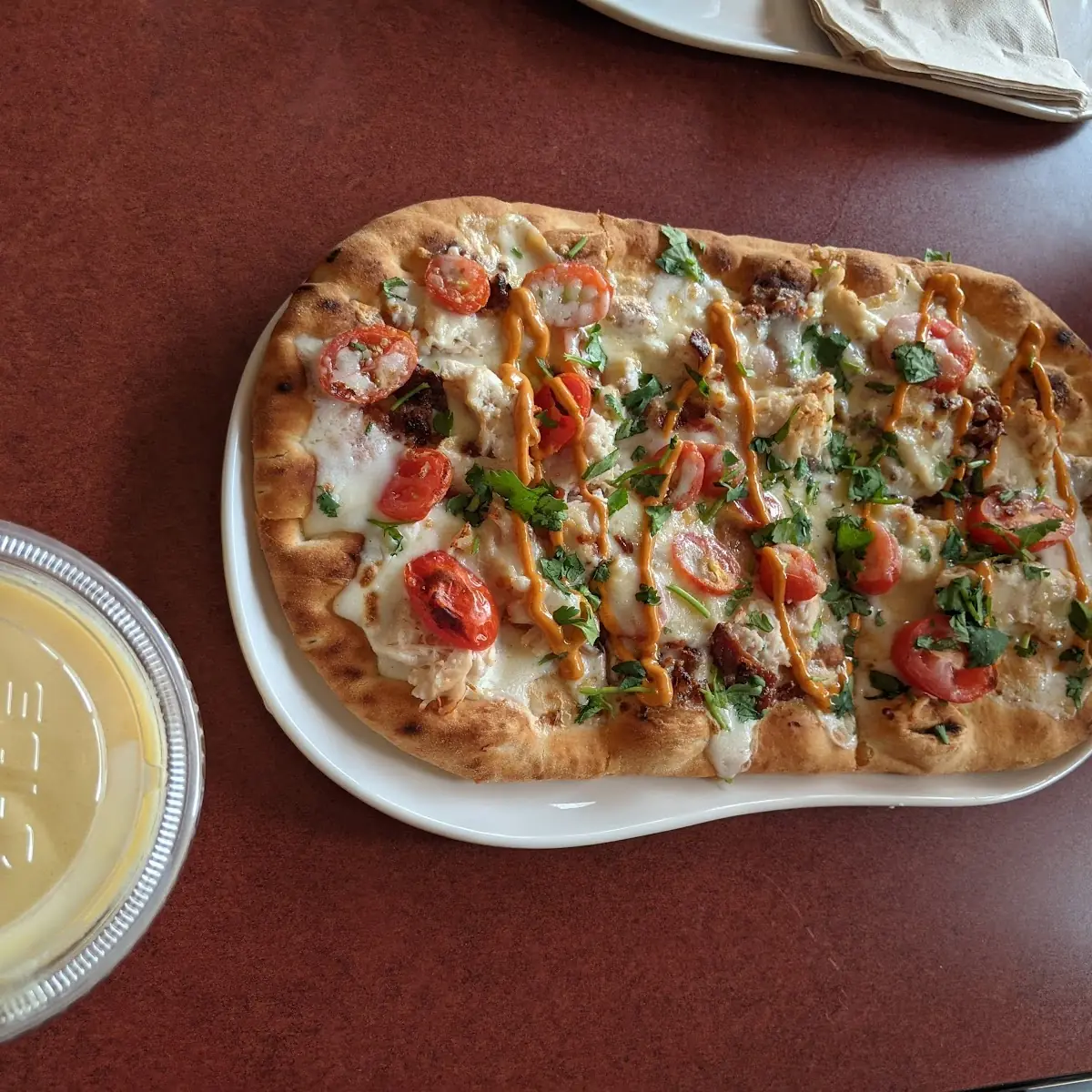 Chipotle Chicken & Bacon Flatbread Pizza Accompanied with a Mango Smoothie