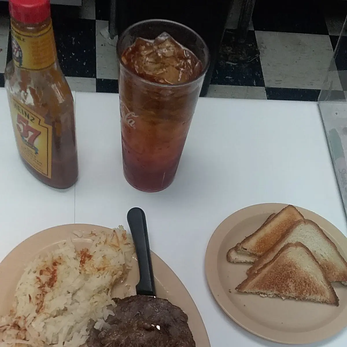 Ribeye Steak Hash Browns Two Eggs Sunny Side Up and Toast