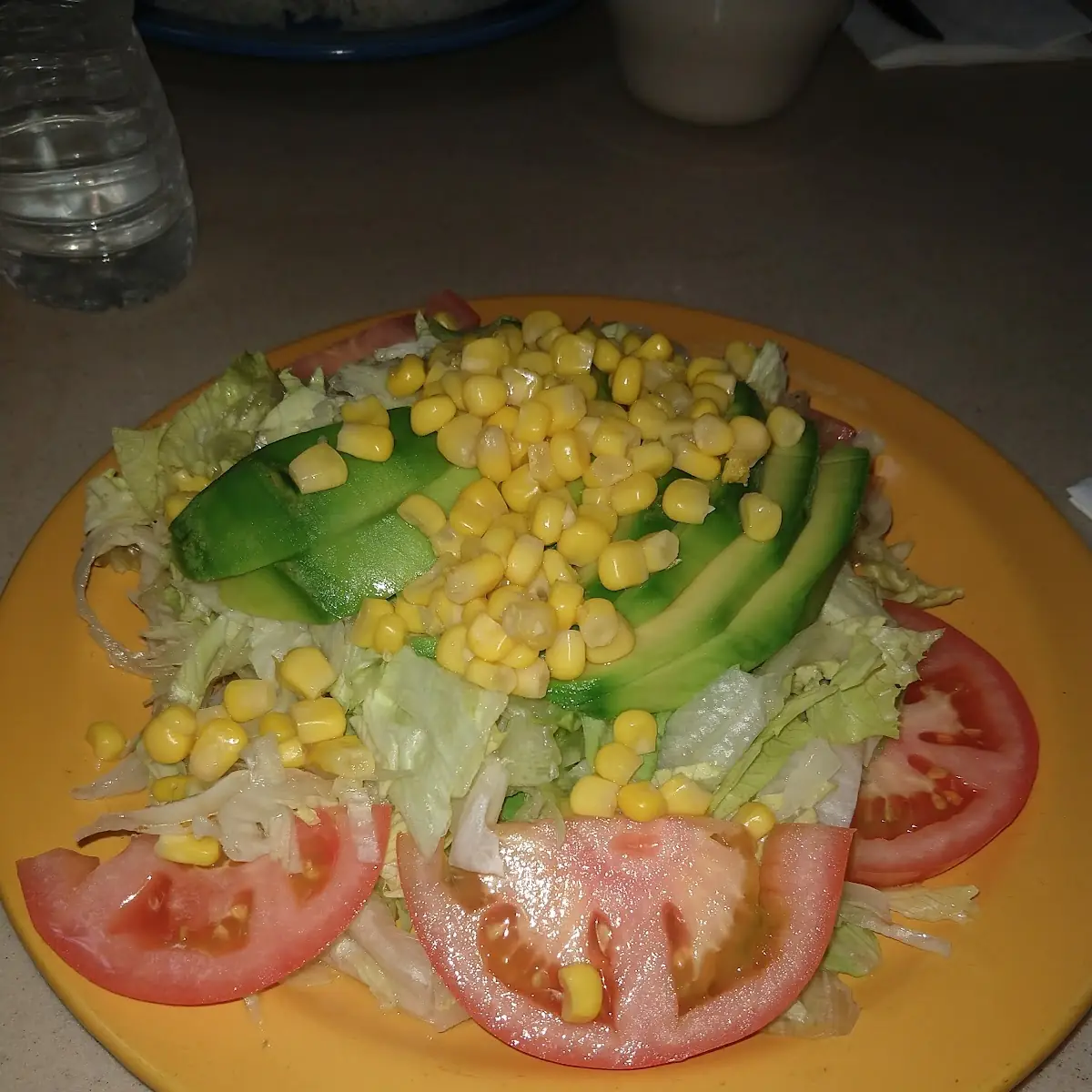 Avocado over Corn and Green Salad