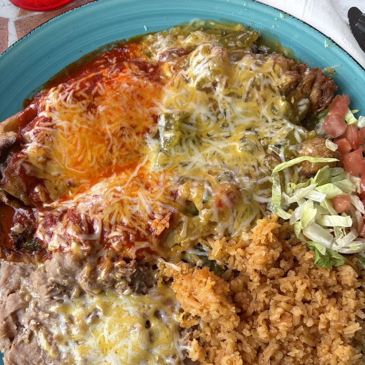 Cheesy Enchiladas Rice and Refried Beans