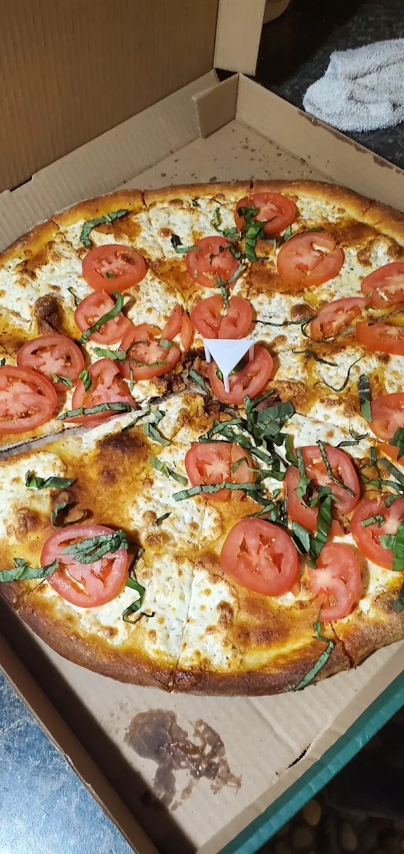 Margarita Pizza over Cooked with Raw Tomatoes