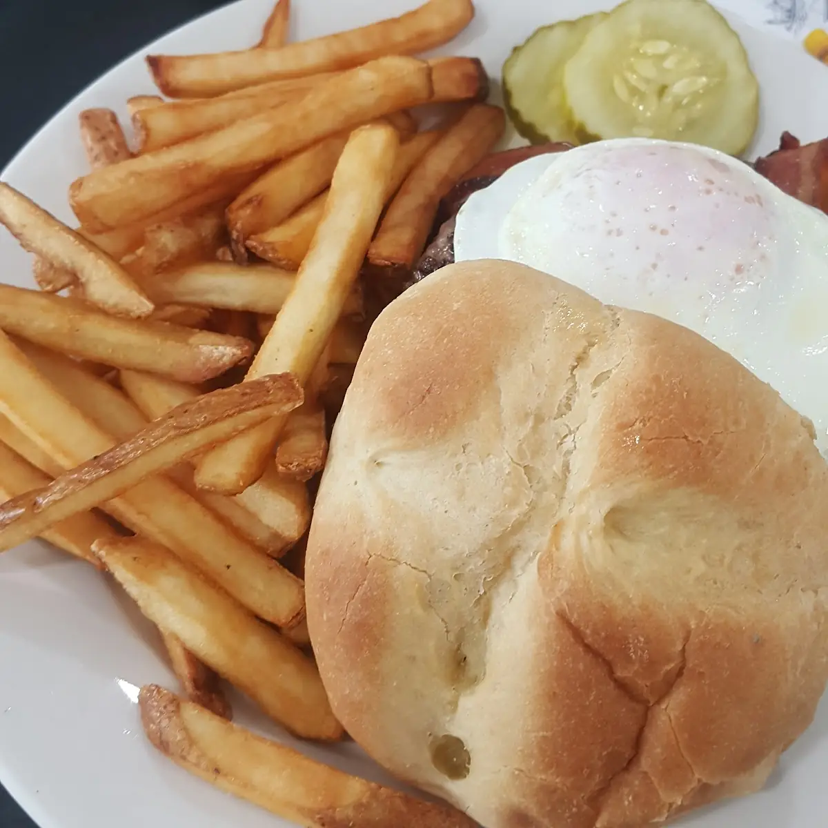 Burger with Fried Egg and Bacon and Fries