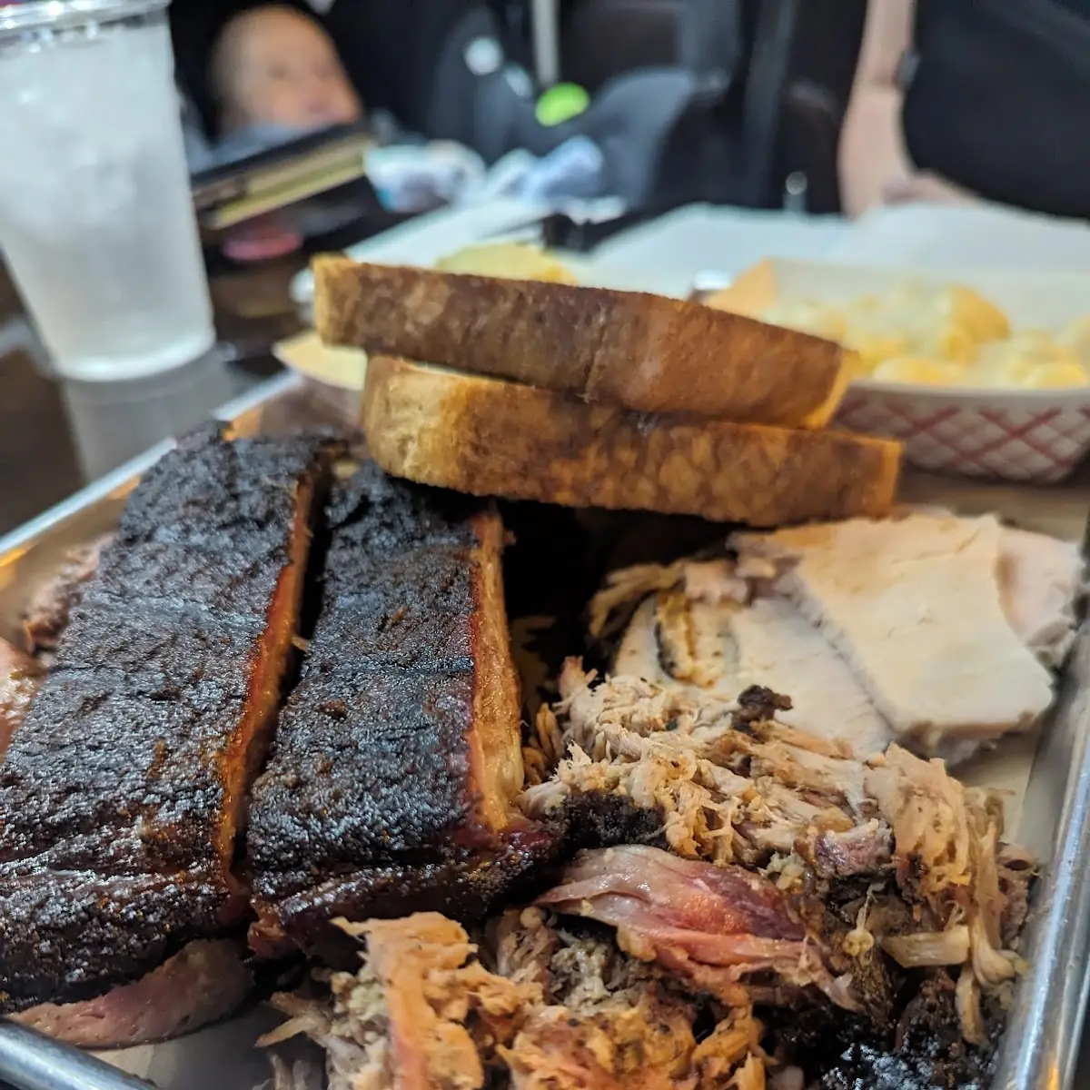 Three Meat Plate with Sliced Brisket Pork Ribs Burnt Ends Macaroni & Cheese and French Fries