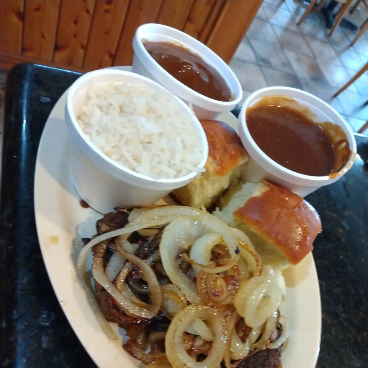 Hamburger Steak with Sauteed Onions & Brown Gravy over Mashed Potatoes & a Roll