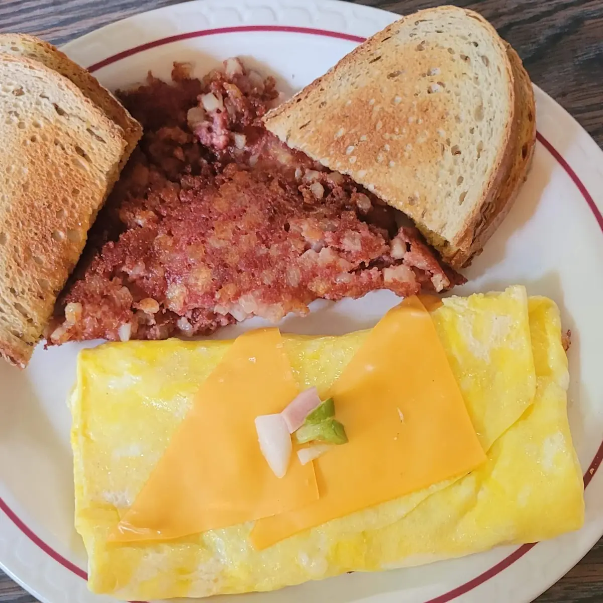 Crispy Hash and a Western Omelette with Crispy Corned Beef Hash Cooked to Perfection