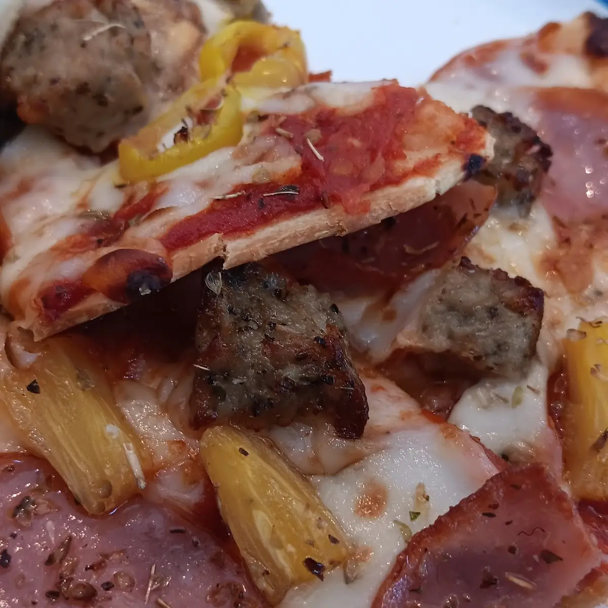 Thin Crust Pineapple and Sausage Pizza