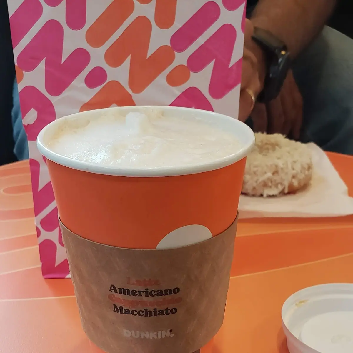 Chocolate Frosted Donut with a Cappuccino