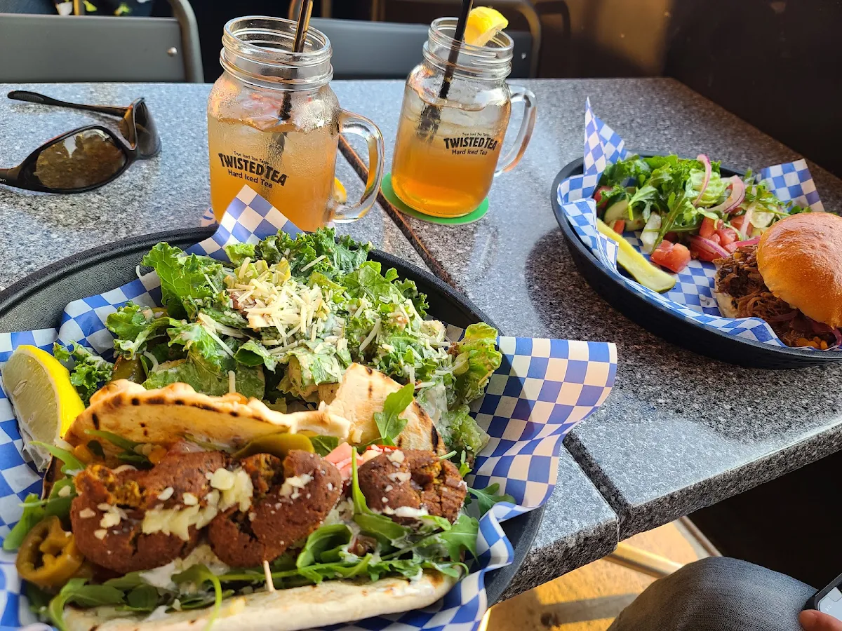 Falafel Wrap and Pulled Pirk Sandwich with Salads
