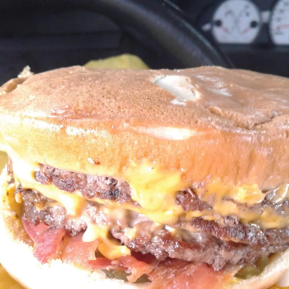 A Number 3 Triple Cheeseburger Everything on It Including Bacon and Jalapenos
