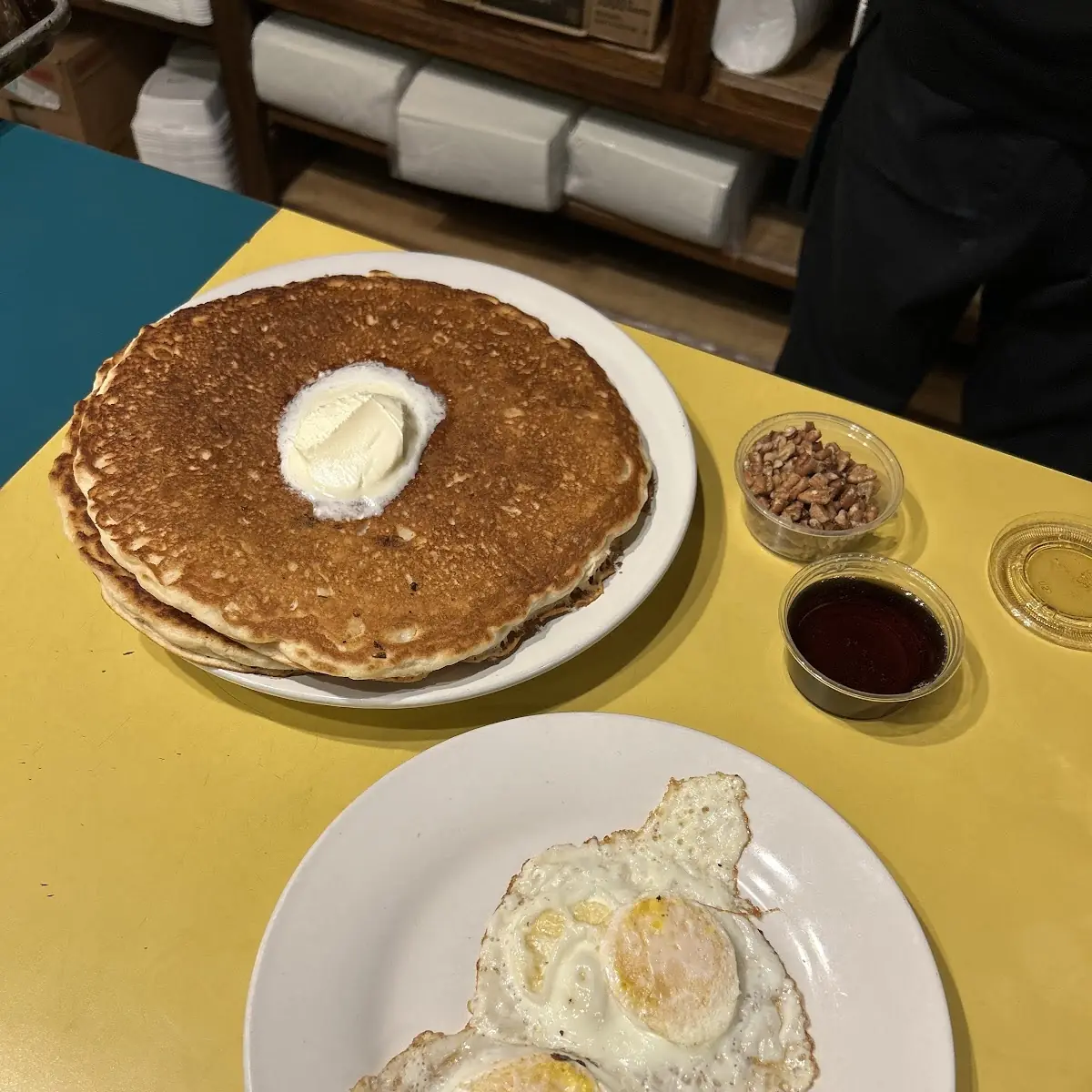 Banana Pecan Pancakes and Eggs with Real Maple Syrup