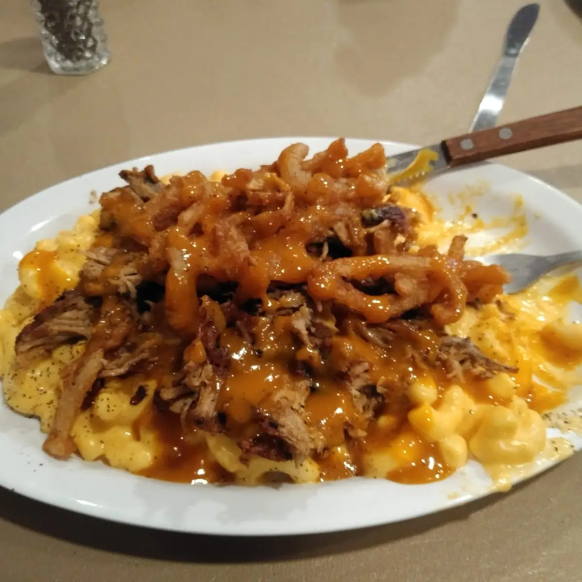 Mac and Cheese Topped with Pulled Pork in Carolina Gold BBQ Sauce