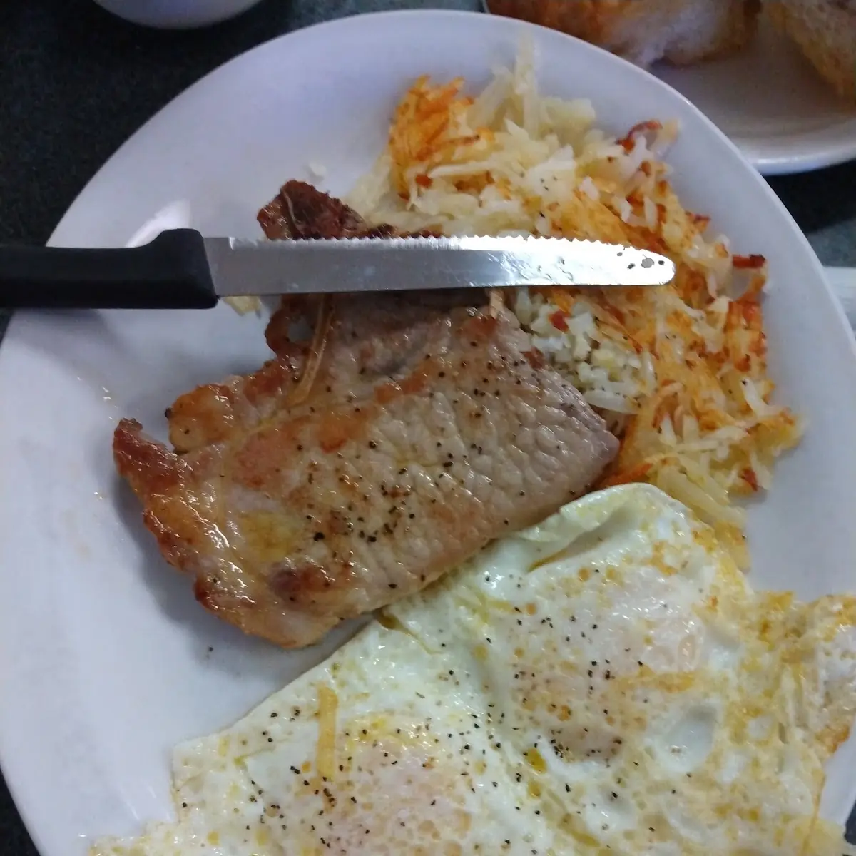 Pork Chop with Eggs and Hash Browns and Biscuits