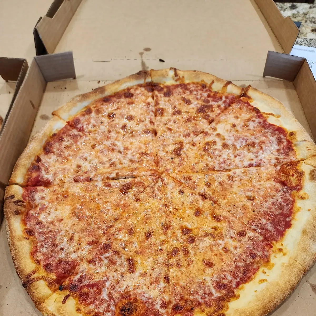Pepperoni Pizza with Basil Leaves