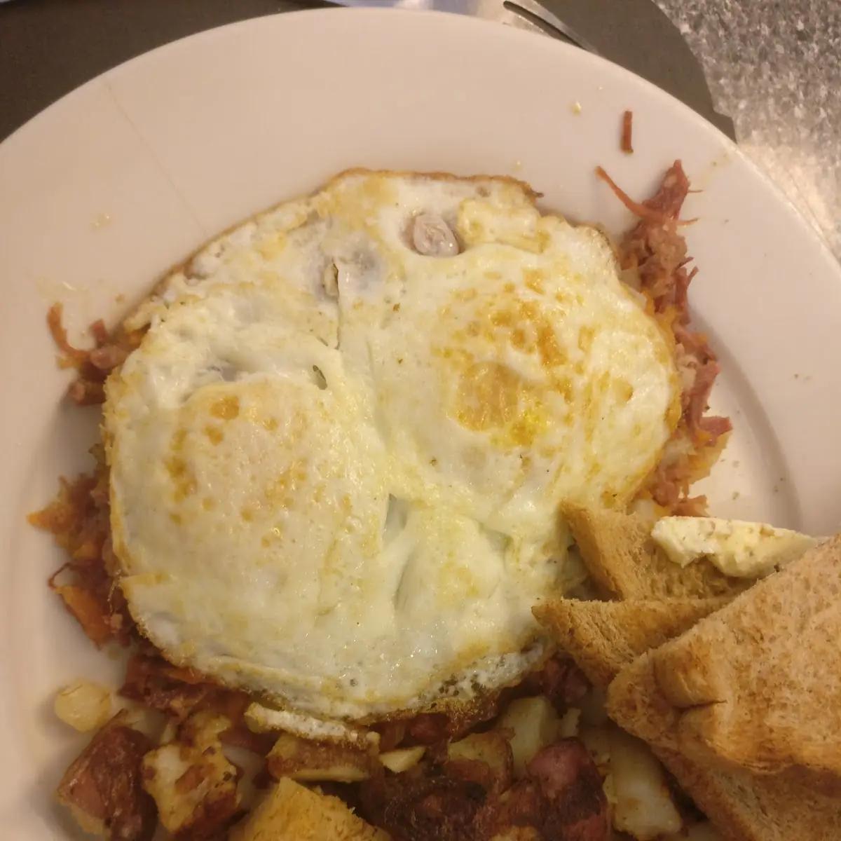 Corned Beef Hash with Eggs over Medium