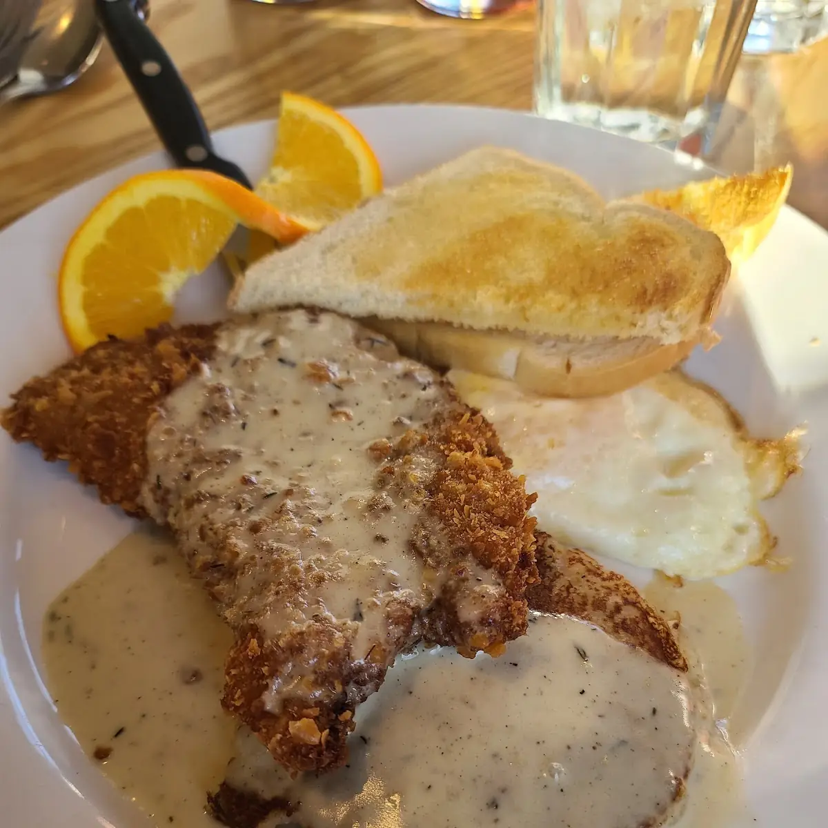 Chicken-Fried Steak and Eggs with Two Cage-Free Eggs Mashed Potato Cakes & Chicken Gravy