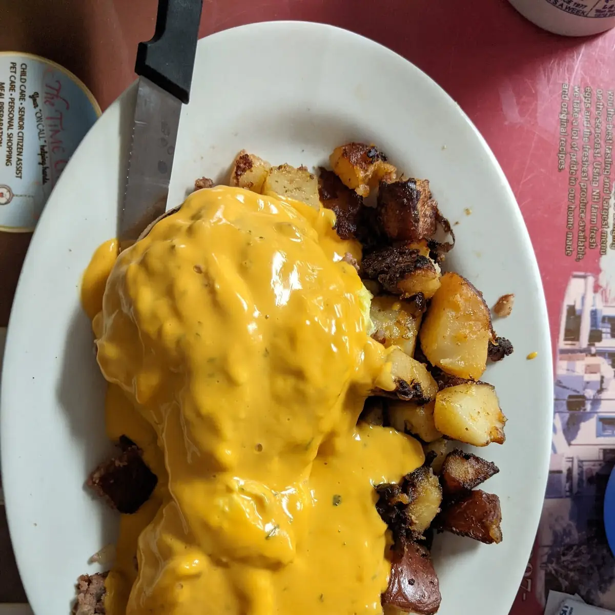 Corned Beef Hash and Scrambled Egg on Bagel with Cheese Sauce