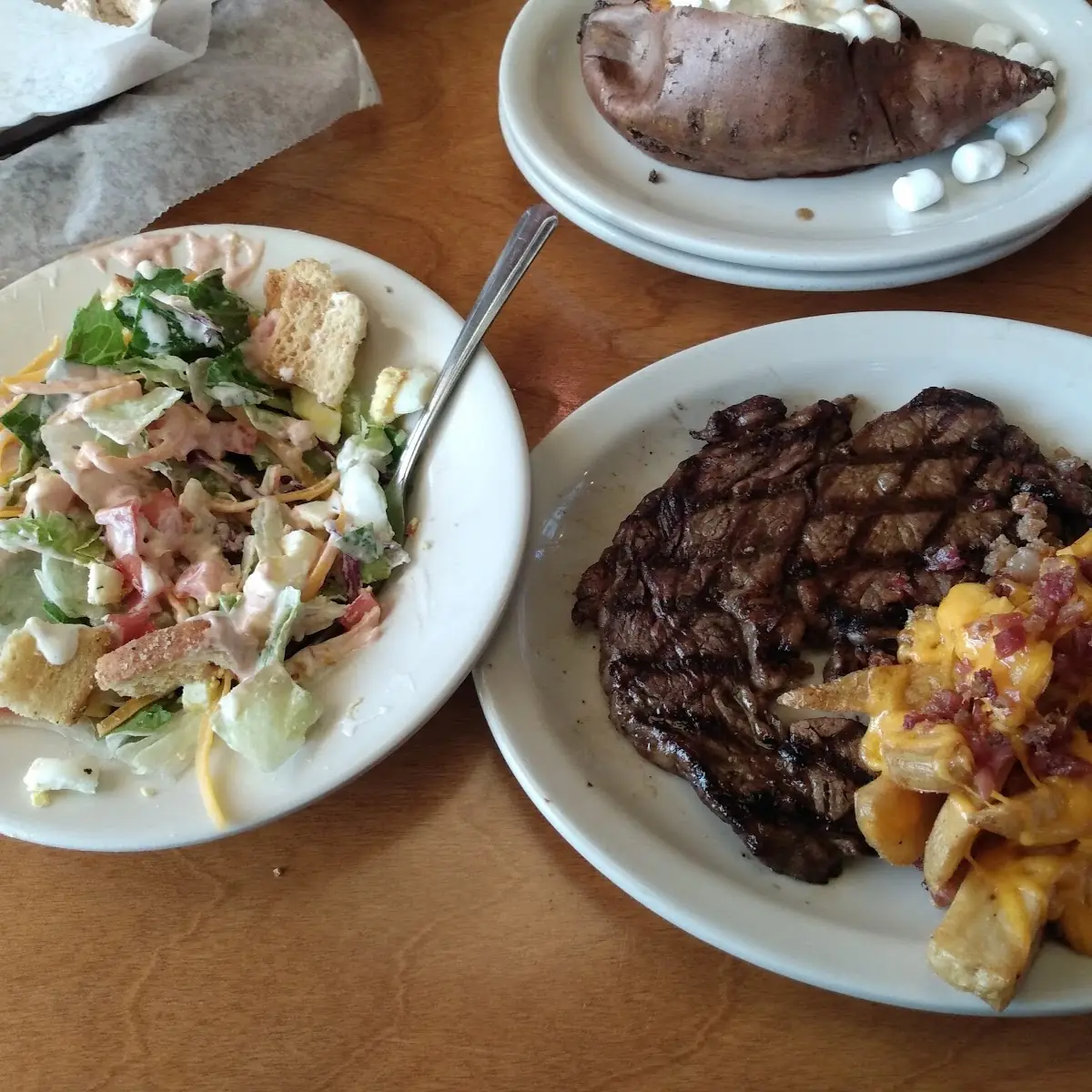 Buttered Com House Salad Steak Fries