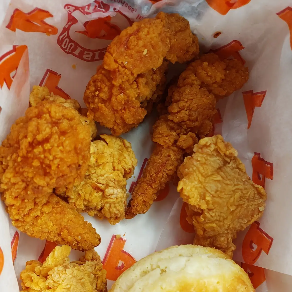 Mild Fried Chicken Breast Along with a Biscuit