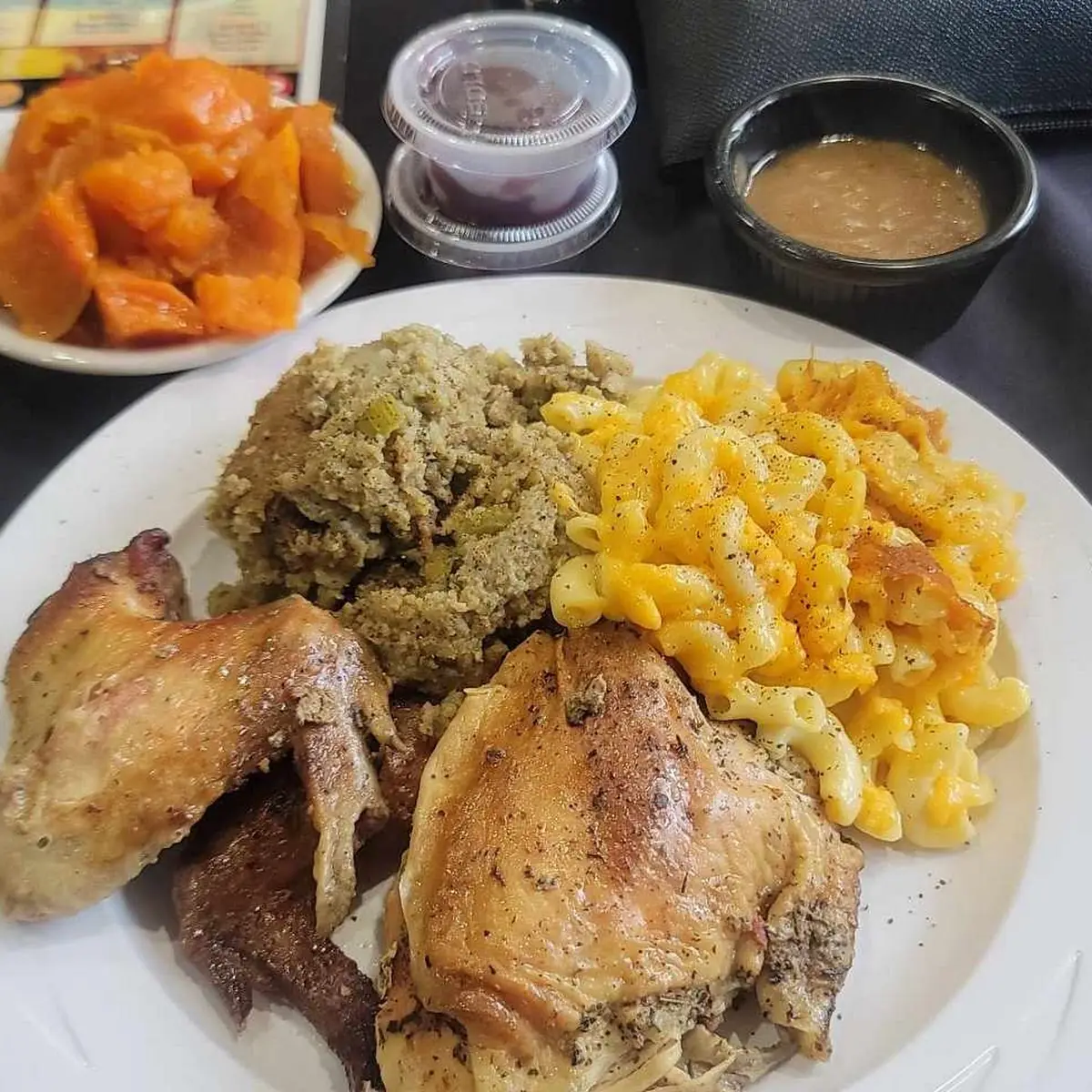 Baked Chicken with Gravy Cornbread Dressing Mac & Cheese Candied Yams & Cornbread Muffins
