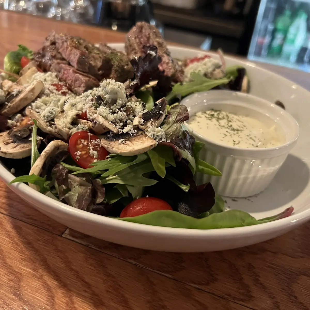 Steak on Salad Fire Grilled N Y Strip, Sandy's Riverside Grill