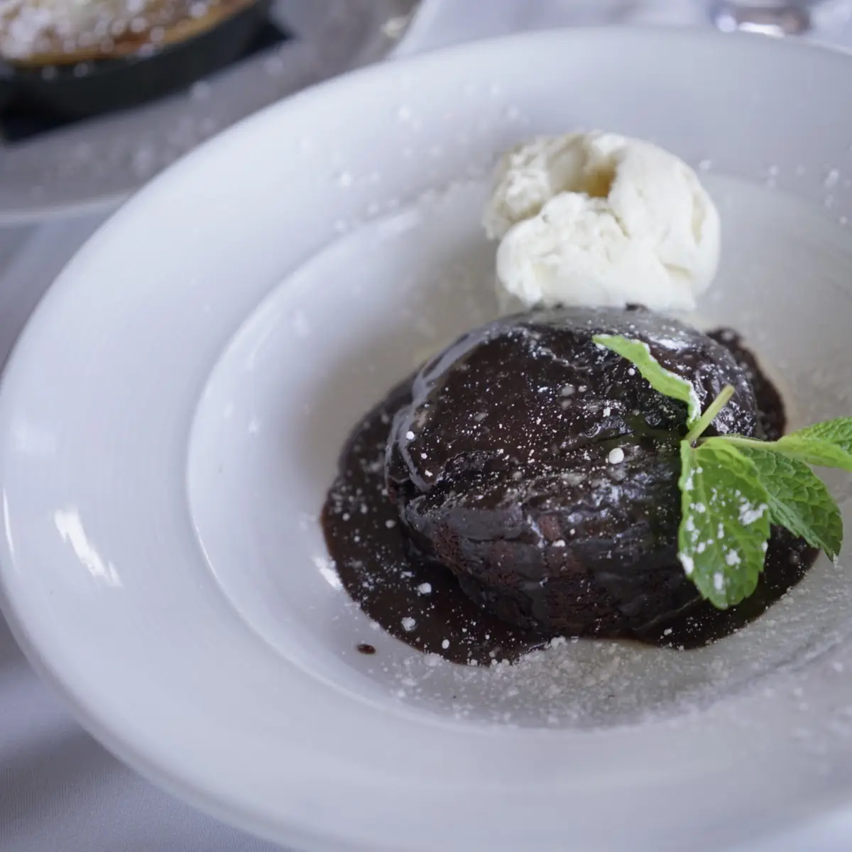 Warm Belgian Chocolate Cake with Vanilla Bean Ice Cream and Mixed Seasonal Berries