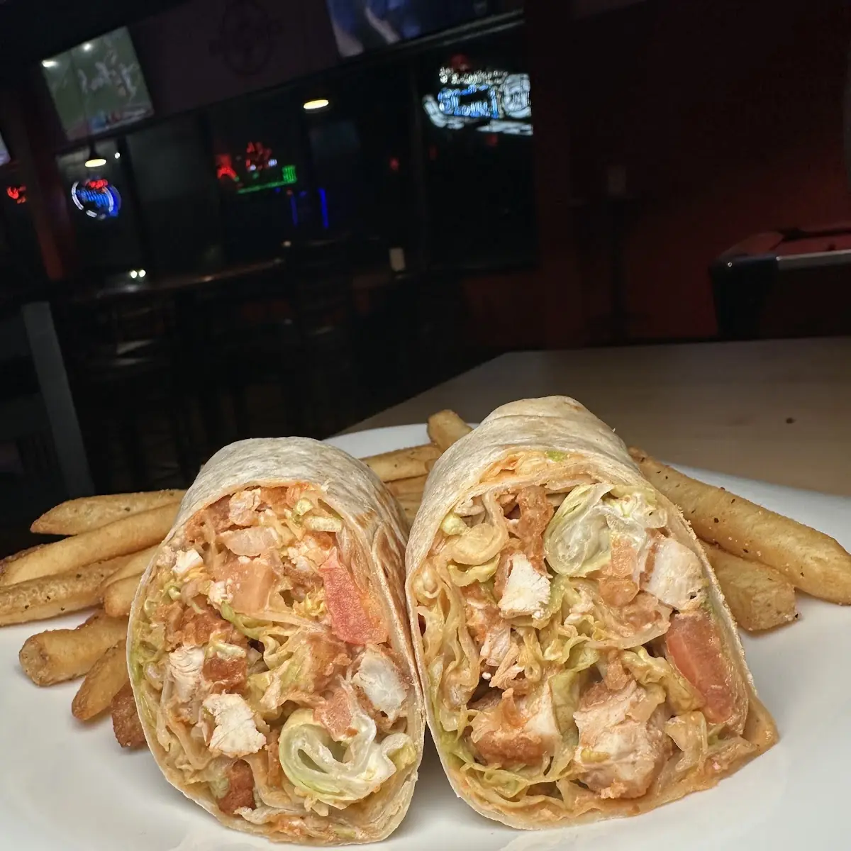 Buffalo Blue Chicken Wrap with Lettuce Tomato and Blue Cheese