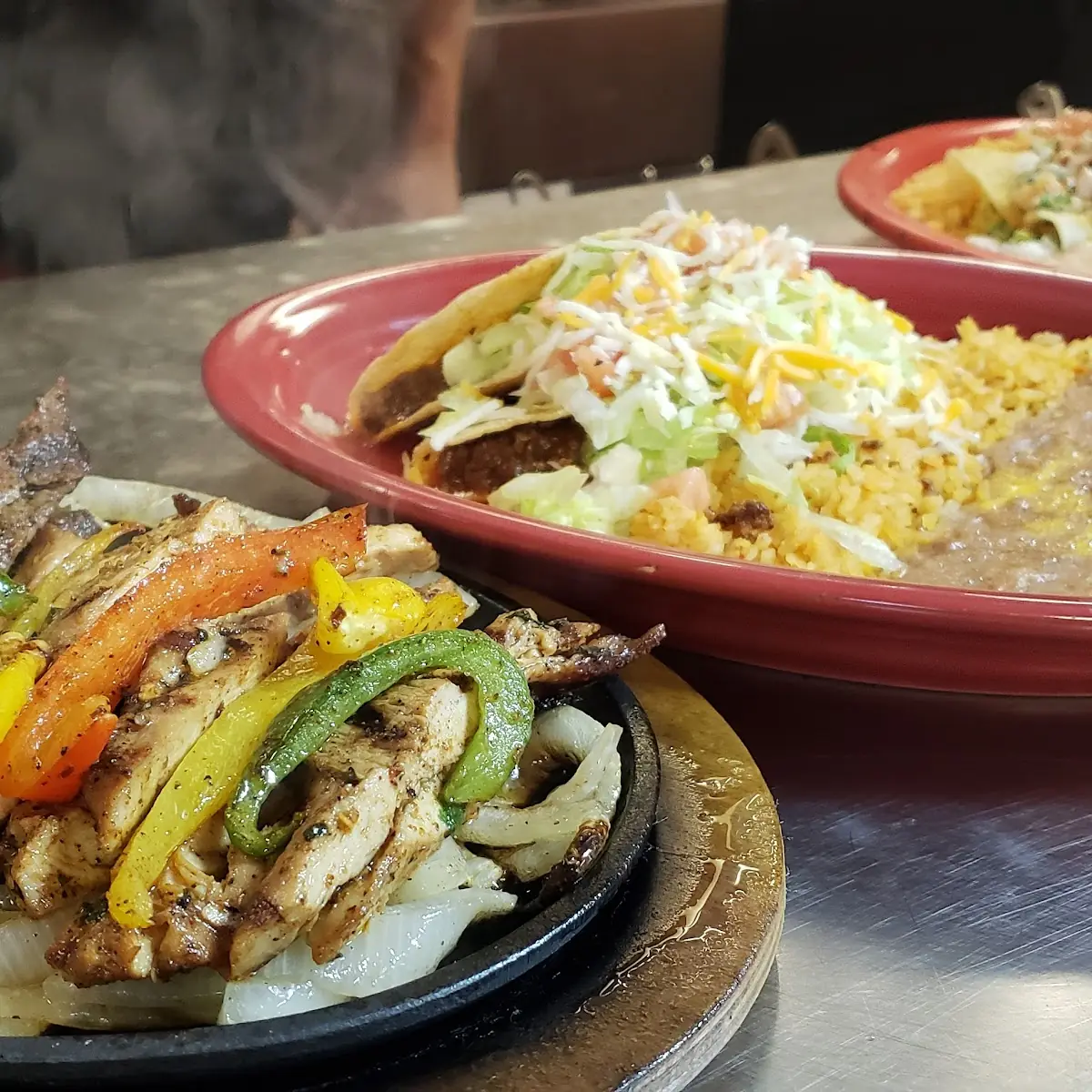 8. Two Cheese Enchiladas Topped with Chili, Beef Fajita, Pico Served with Rice and Beans